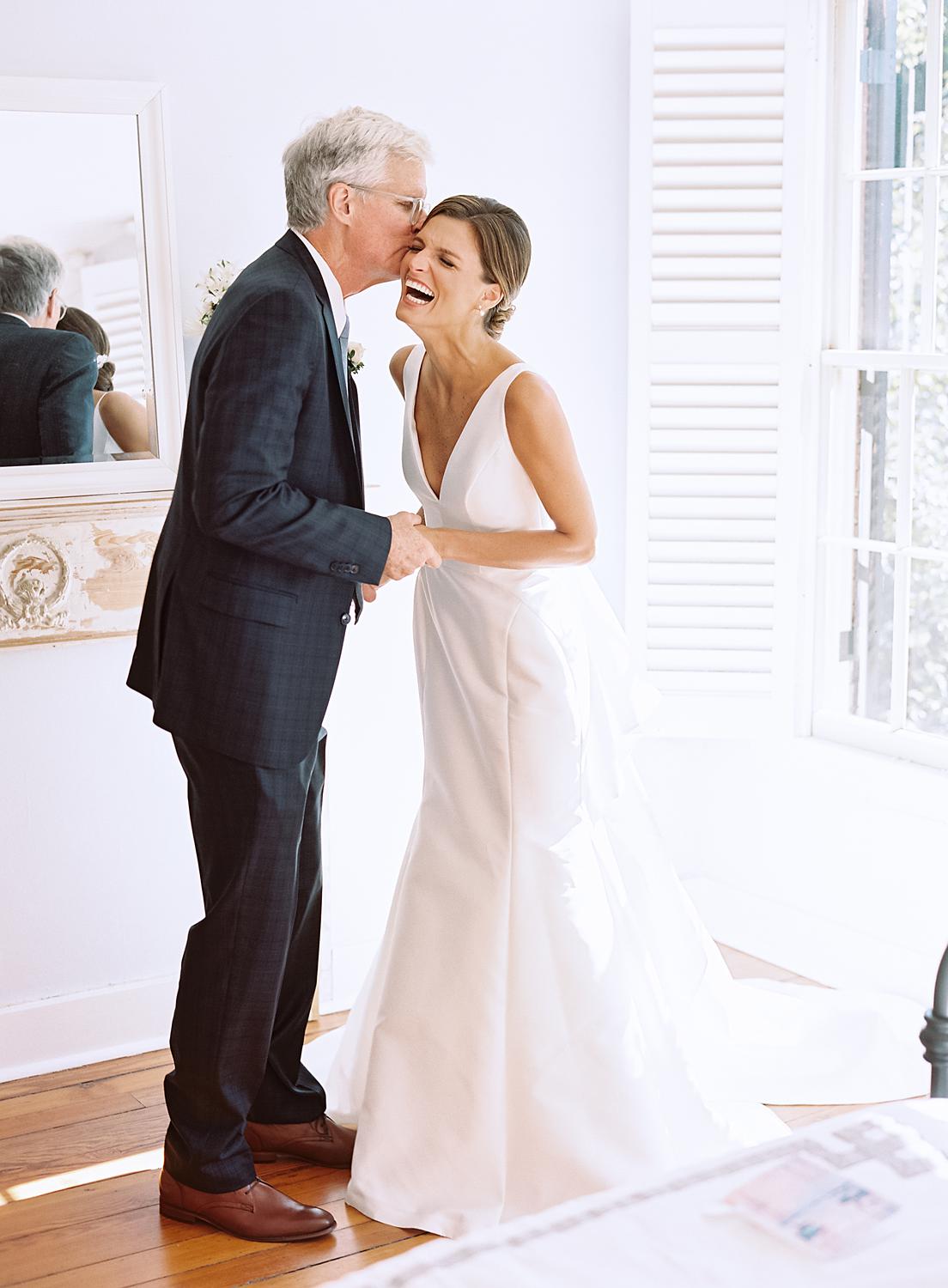 Bride seeing her father after stepping into her dress before her William Paca House Wedding in Annapolis