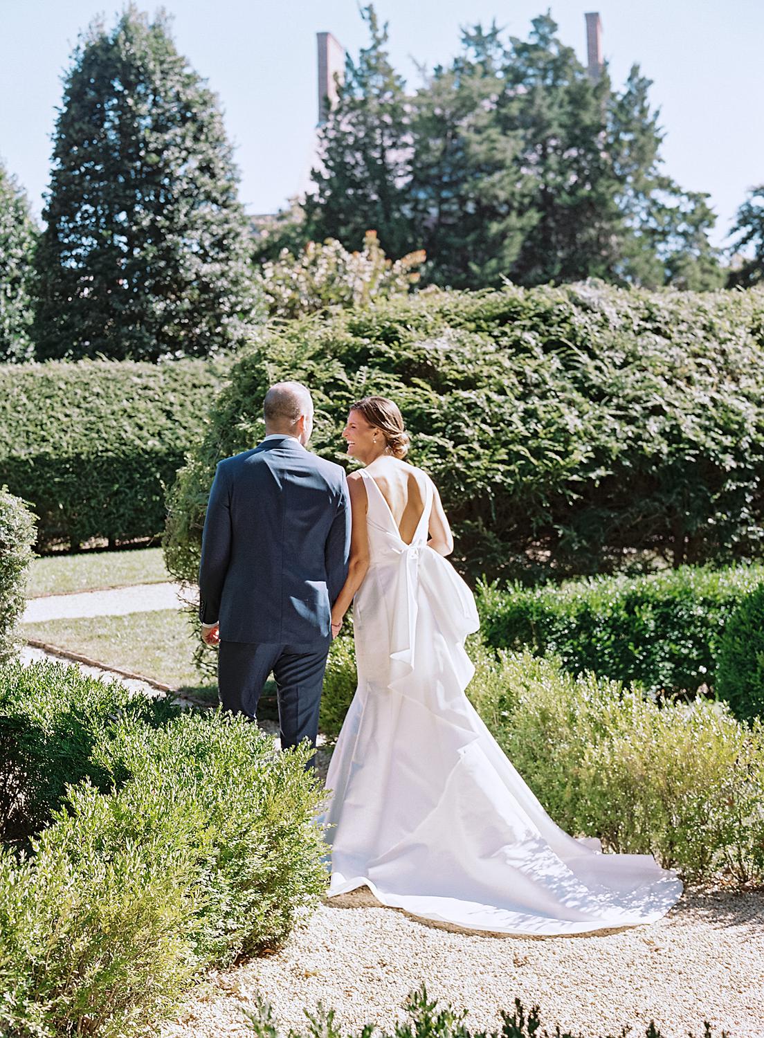 Bride and groom walking out together after their first look in Annapolis