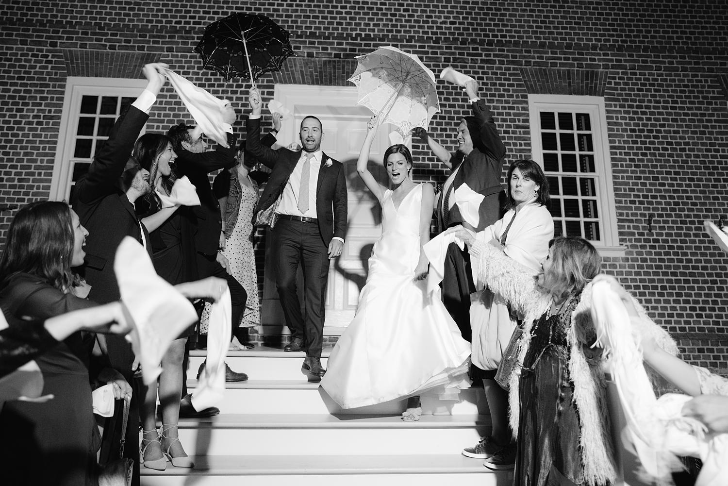 Bride and groom exiting after their wedding reception at The William Paca House.